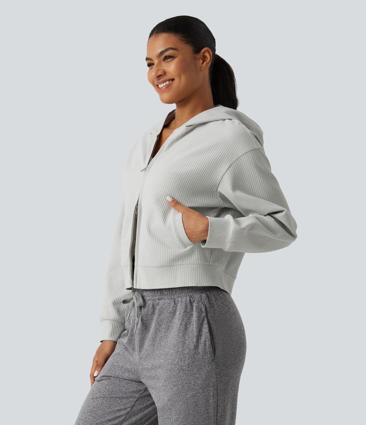 Langeärmelige, lässige Kapuzenjacke aus Waffelstrick mit Taschen Langeärmelige, lässige Kapuzenjacke aus Waffelstrick mit Taschen