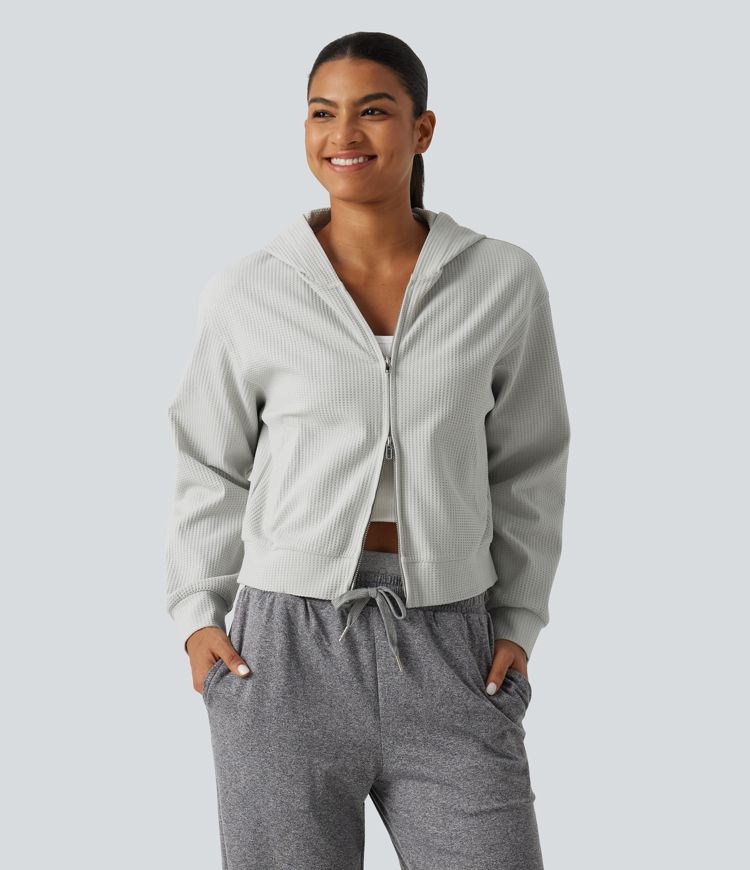 Langeärmelige, lässige Kapuzenjacke aus Waffelstrick mit Taschen Langeärmelige, lässige Kapuzenjacke aus Waffelstrick mit Taschen