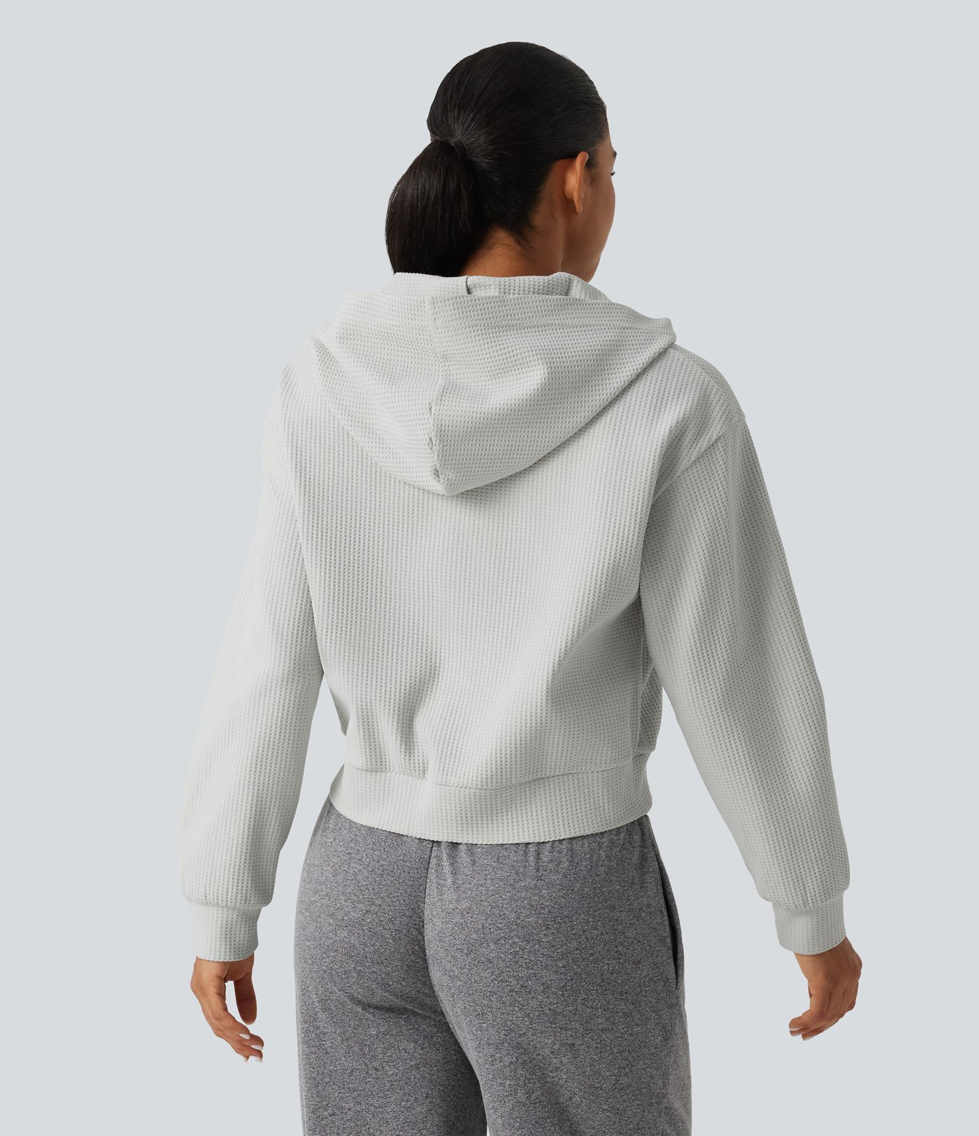 Langeärmelige, lässige Kapuzenjacke aus Waffelstrick mit Taschen Langeärmelige, lässige Kapuzenjacke aus Waffelstrick mit Taschen