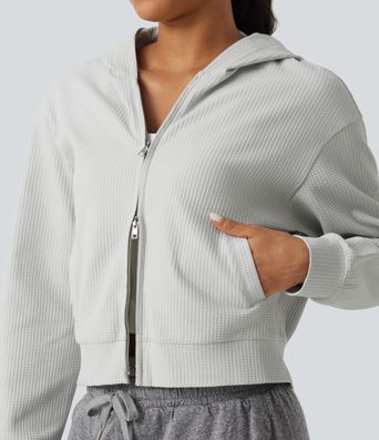Langeärmelige, lässige Kapuzenjacke aus Waffelstrick mit Taschen Langeärmelige, lässige Kapuzenjacke aus Waffelstrick mit Taschen