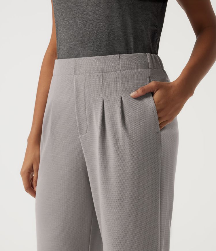 Pantalones casual acampanados de cintura alta en tejido waffle con bolsillos
