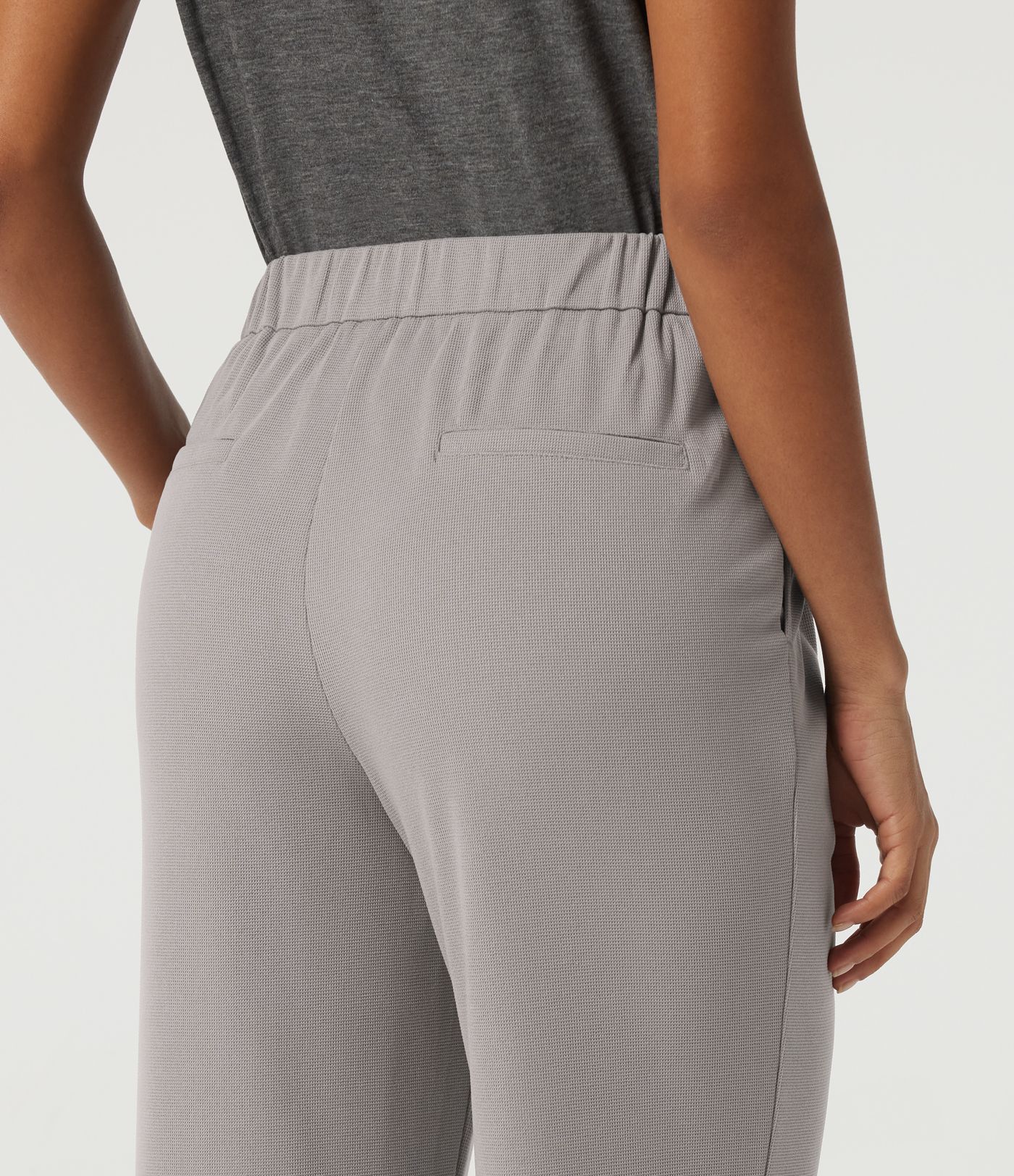 Pantalones casual acampanados de cintura alta en tejido waffle con bolsillos