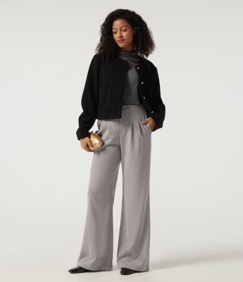 Pantalones casual acampanados de cintura alta en tejido waffle con bolsillos