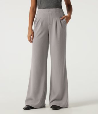 Pantalones casual acampanados de cintura alta en tejido waffle con bolsillos