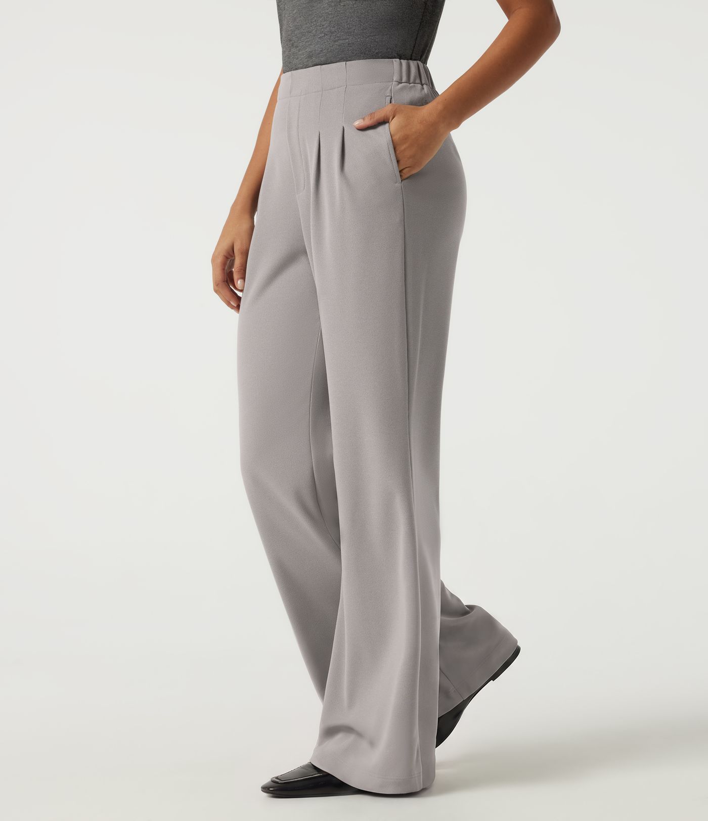 Pantalones casual acampanados de cintura alta en tejido waffle con bolsillos