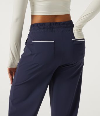 Pantalon de tennis taille haute à cordon, jambe large, ourlet incurvé, à blocs de couleur, séchage rapide InstantCool, avec poches — UPF40+