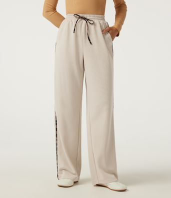 Pantalon décontracté en tissu gaufré, taille haute, à cordon, coupe droite, bande latérale, imprimé léopard, avec poches.