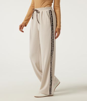 Pantalon décontracté en tissu gaufré, taille haute, à cordon, coupe droite, bande latérale, imprimé léopard, avec poches.