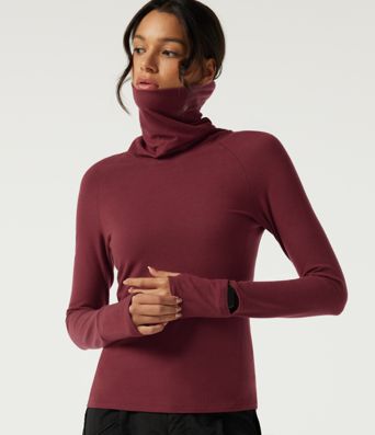 Halara HeatCore top casual térmico de cuello alto, manga larga raglán, con aberturas para los pulgares.