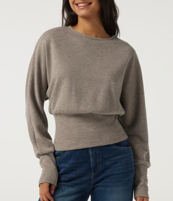 Top casual de punto acanalado con cuello redondo y mangas largas