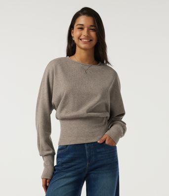 Top casual de punto acanalado con cuello redondo y mangas largas