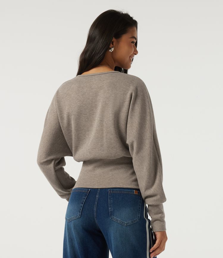 Top casual de punto acanalado con cuello redondo y mangas largas