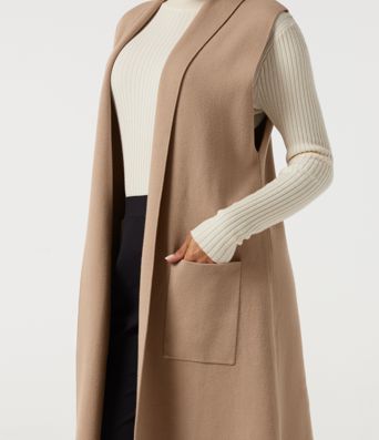 Cardigan long sans manches, ouvert sur le devant, avec poches