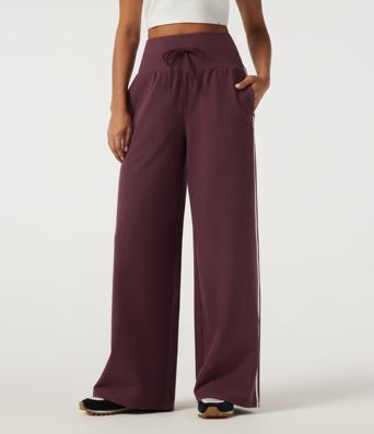 Hoch taillierte, bauchformende, weit geschnittene Colorblock-Freizeithose mit seitlichem Streifen und Taschen