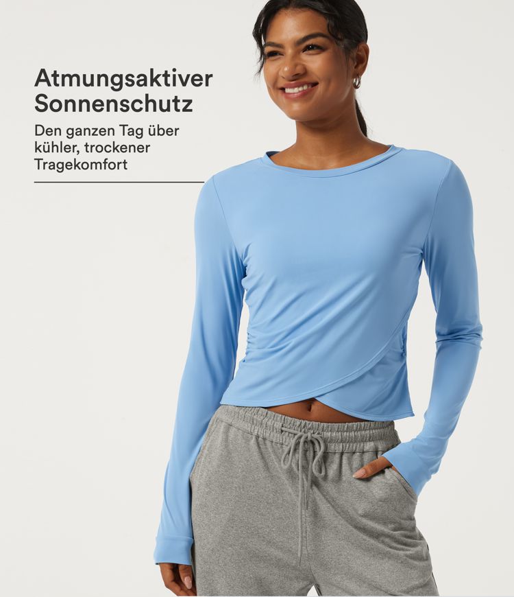 Dusk Blue Lässiges, gerafftes Top mit Rundhalsausschnitt, langen Ärmeln, Crossover-Design und geschwungenem Saum - UPF40+ / 1